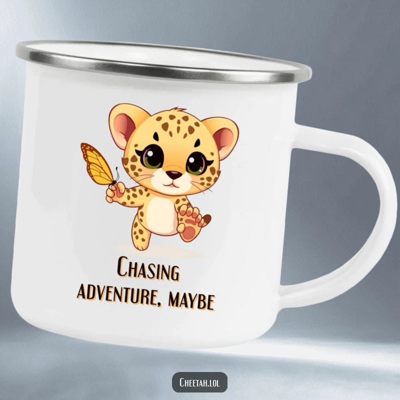 Funny cheetah cub playfully chasing a butterfly with wide eyes, a durable and humorous camping mug for playful adventures.