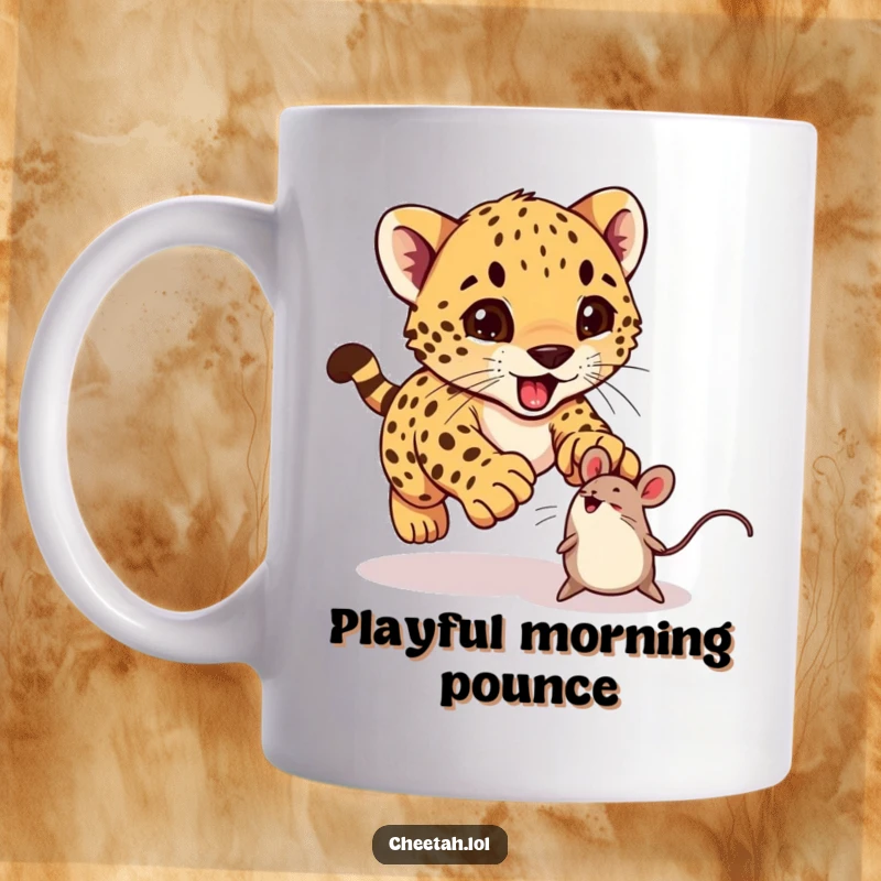 Funny cheetah cub excitedly pouncing on a bouncing toy mouse on a mug, perfect for playful people.