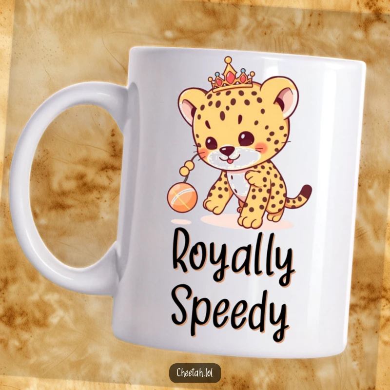 Funny cheetah cub mug with a tiara, playfully chasing a dangling toy ball, showcasing cute and regal fun.