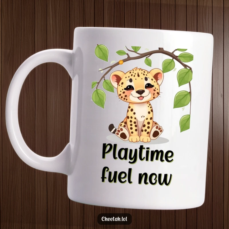 Funny cheetah cub mug depicting a playful cub happily batting at a dangling vine, full of jungle adventure and wild energy.