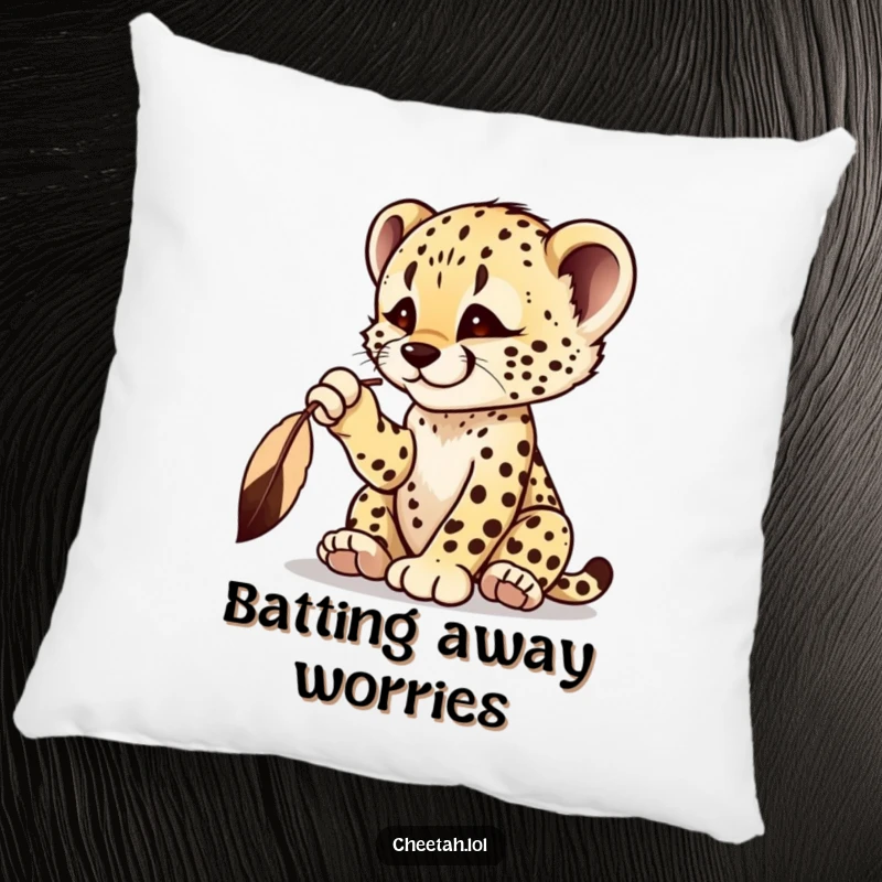 Funny cheetah cub pillow featuring a playful cub batting at a dangling feather, radiating curiosity.