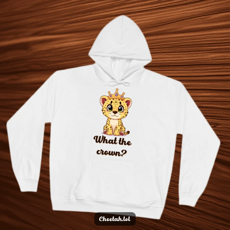 Funny cheetah cub hoodie showing a crowned cub looking surprised with curious eyes, offering cozy and charming vibes.