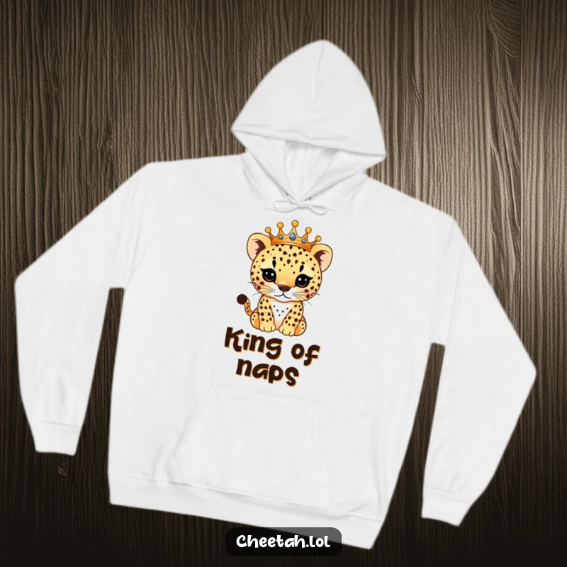 Funny Hoodie depicting a majestic cheetah cub adorned with a glittering crown, its patterned spots sparkling, offering warmth and royal humor.