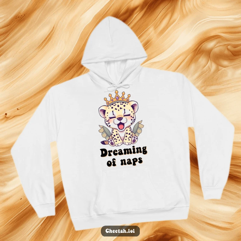 Funny sleepy cheetah cub wearing a regal feathered crown, yawning softly on this warm and cozy hoodie.