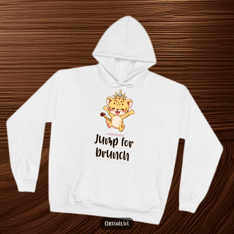 Funny Hoodie depicting a cheetah cub with a sparkling tiara, caught in an exhilarating joyful leap, embodying energy and playful spirit.