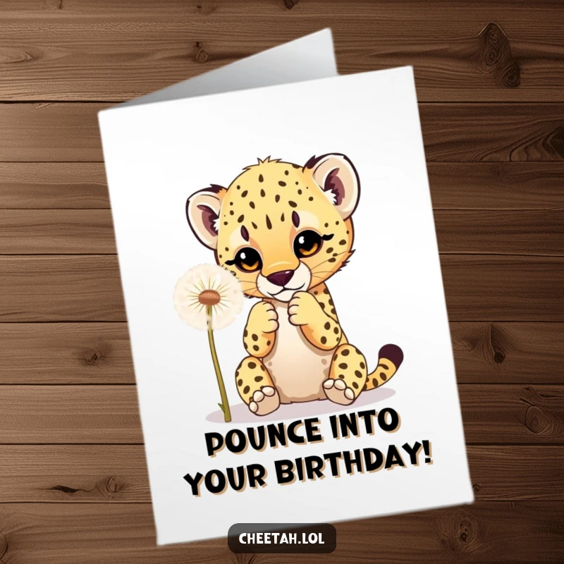 Funny free printable birthday card showing a cute cheetah cub playfully batting at a fluffy dandelion with its tiny paws.