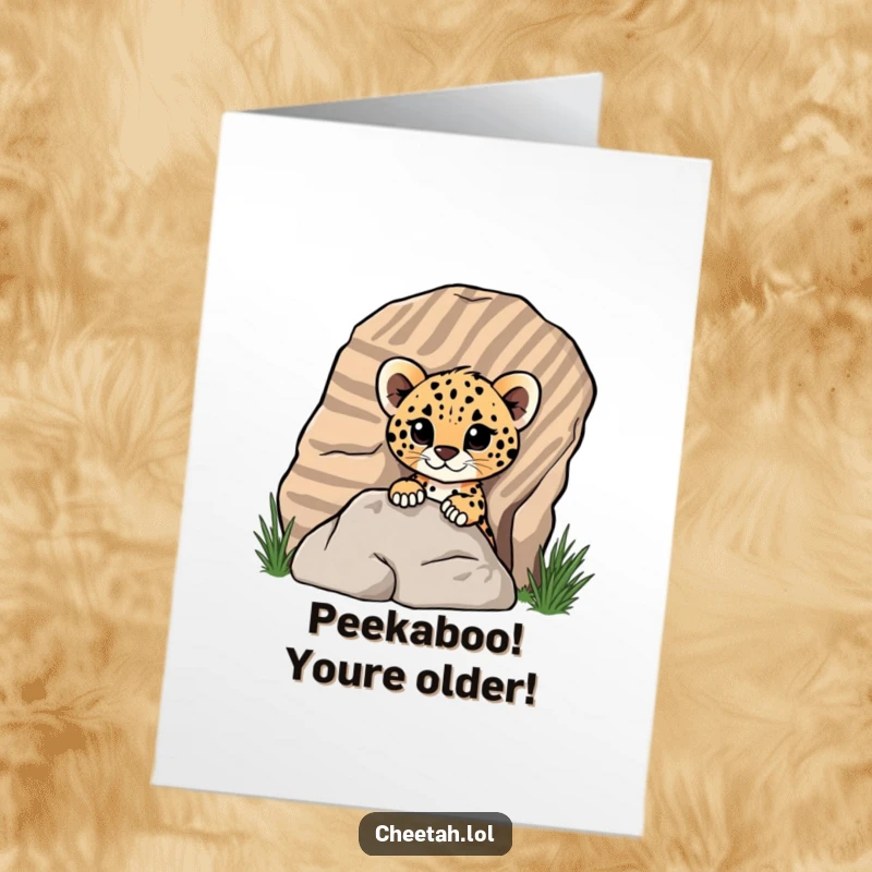 Funny Free Printable Birthday Card featuring a cute cheetah cub playfully peeking from behind a striped rock, filled with birthday cheer.