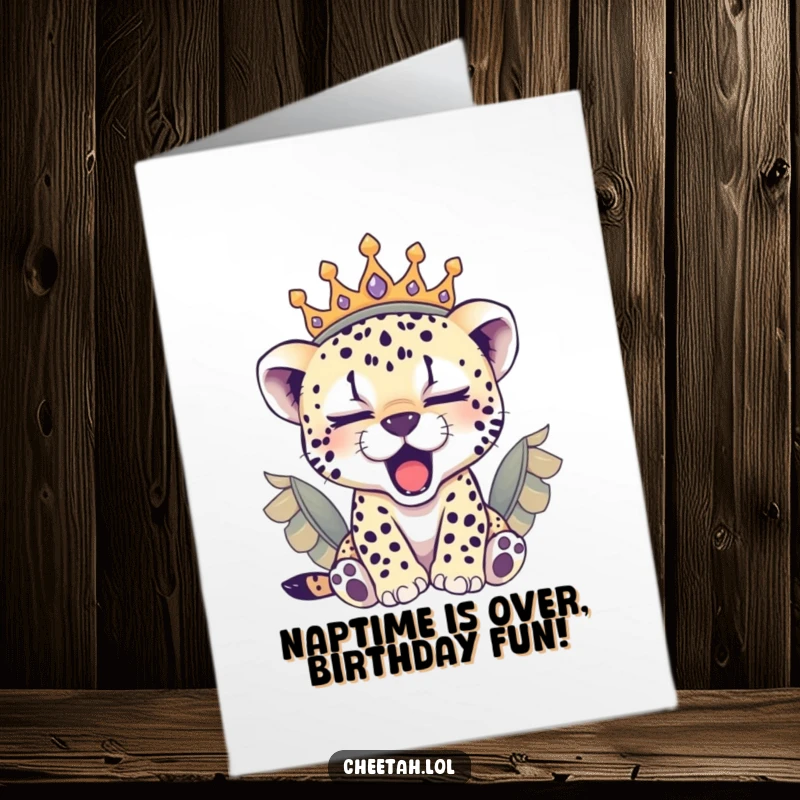 Funny Free Printable Birthday Card: Sleepy cheetah cub wearing a feathered crown, yawning adorably, wishing happy birthday.
