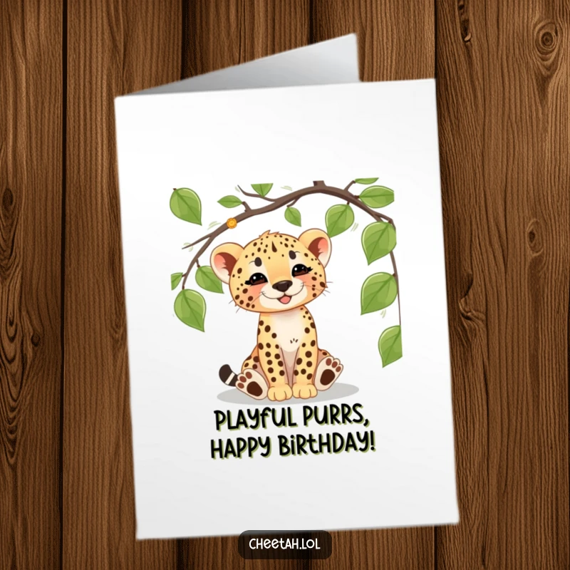 Funny Free Printable Birthday Card: A cheetah cub gleefully batting at a dangling jungle vine, celebrating a birthday.