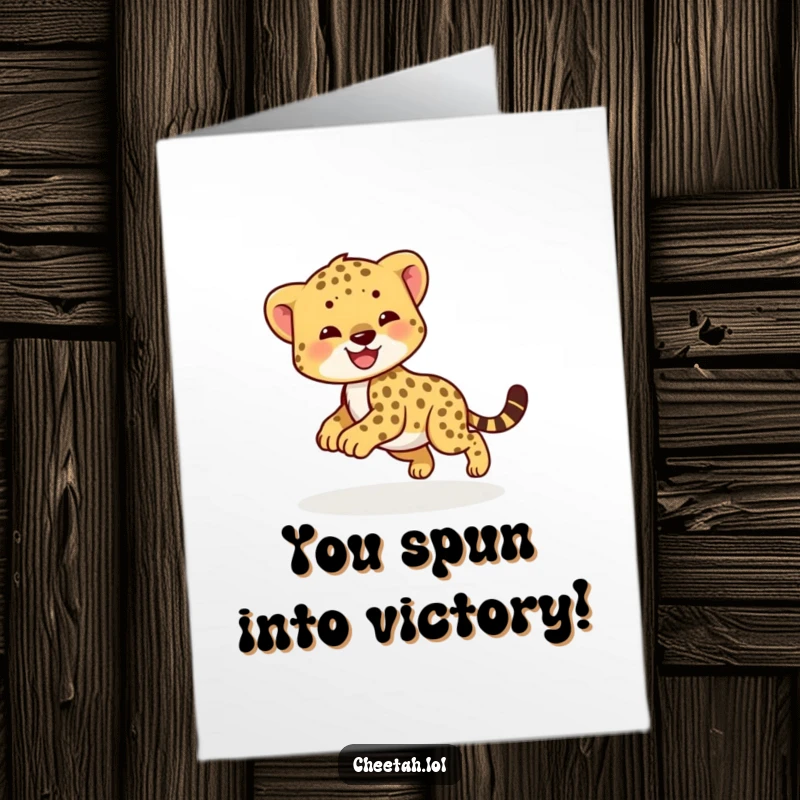 Funny Free Printable Congratulations Card: A smiling cheetah cub joyfully chasing its tail in a dizzying, fun circle.
