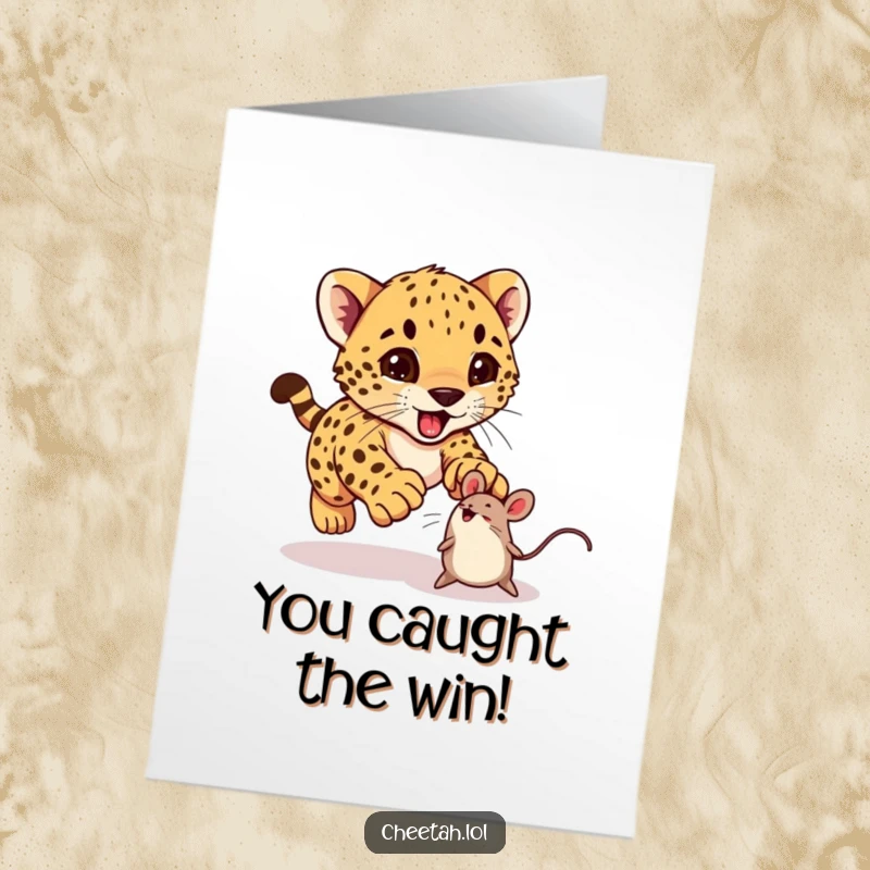 Funny Free Printable Congratulations Card: An adorable cheetah cub excitedly pouncing on a toy mouse after a successful feat.