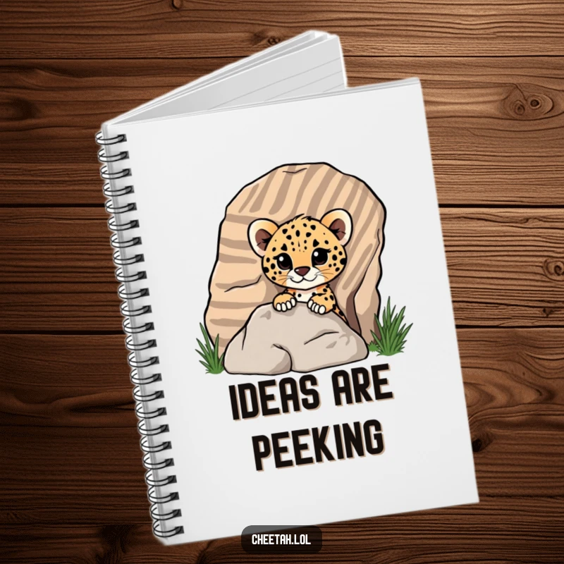 Funny cheetah cub peeking from behind a rock on a notebook cover, showing playful curiosity for screen readers.