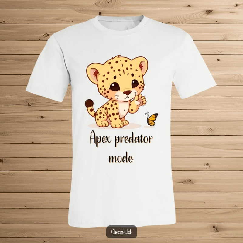 Funny t-shirt with a charming cheetah cub extending a paw, about to hilariously pounce on a tiny butterfly in a playful moment.