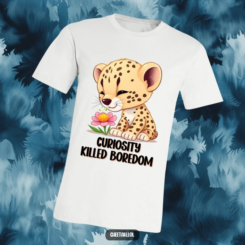 Funny cheetah cub t-shirt depicting a cute cub curiously sniffing a vibrant flower, embodying wonder and nature.