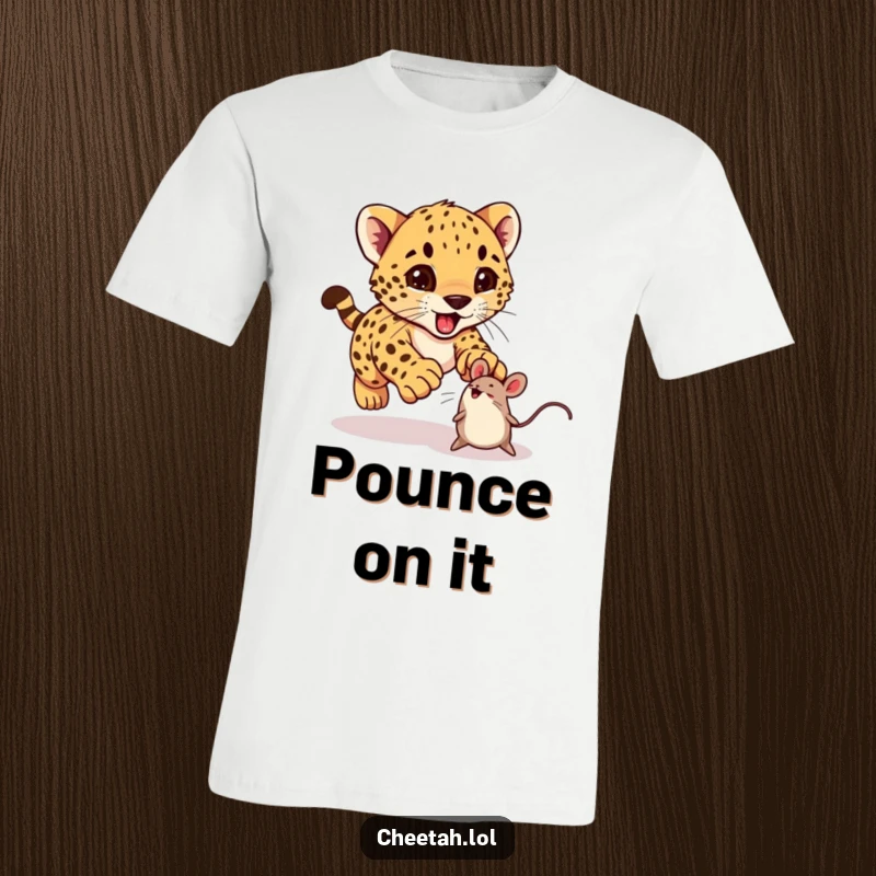 Funny cheetah cub excitedly pouncing on a bouncing toy mouse on a t-shirt, great for kids and adults.