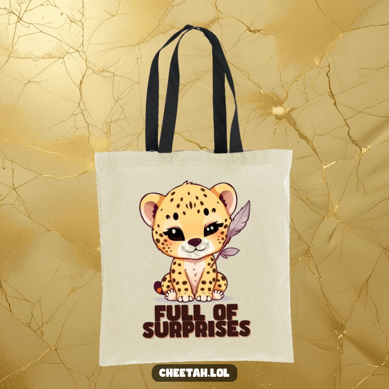 Funny Tote Bag featuring a cheetah cub giving a charming wink while batting at a dangling feather, adding playful humor to everyday use.