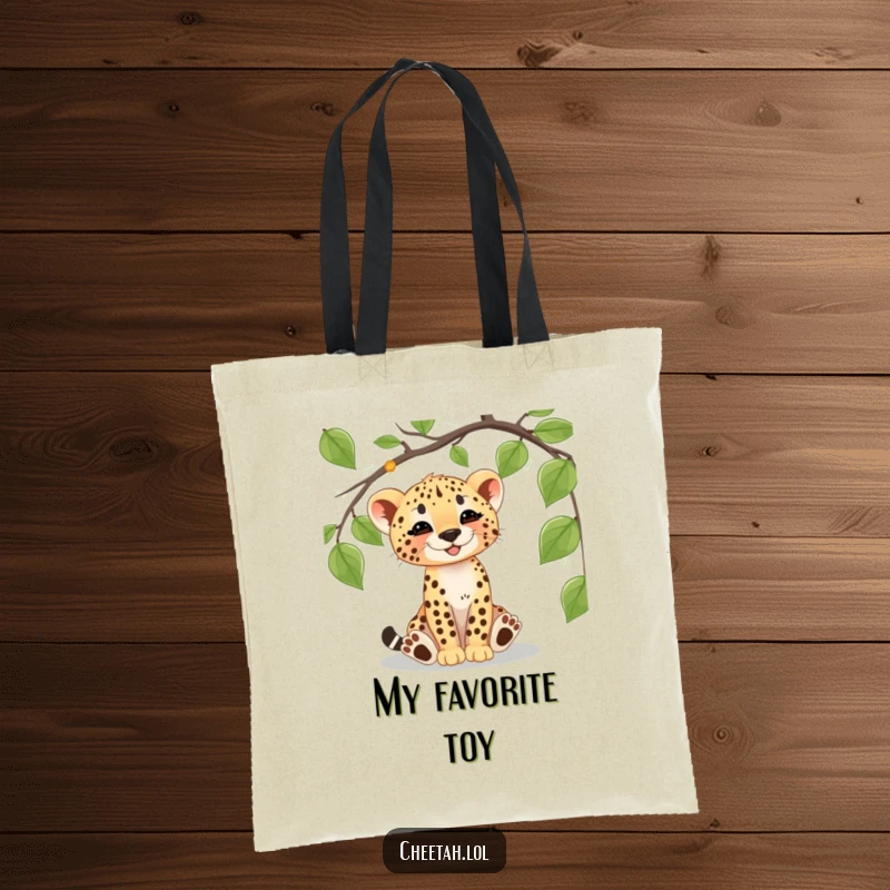 Funny cheetah cub tote bag featuring a playful cub batting at a vine, perfect for carrying essentials with a wild flair.